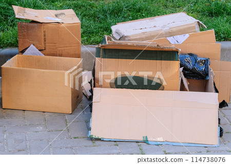 Cardboard and waste paper is packaged for recycling. Pile of cardboard is sorting for recycled. Waste stacked. Cardboard and waste paper is packaged for recycling. Pile of cardboard is sorting for recycled. Waste stacked. 114738076