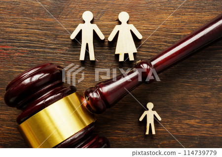 Family figures and gavel. Adoption and guardianship concept. Family figures and gavel. Adoption and guardianship concept. 114739779