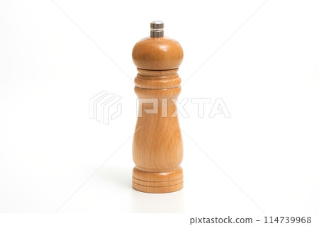 Wooden pepper mill isolated on white background. Cooking concept Wooden pepper mill isolated on white background. Cooking concept 114739968
