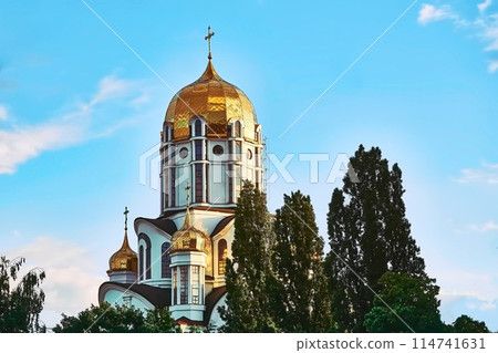 Christian cathedral with golden domes and blue clear sky Christian cathedral with golden domes and blue clear sky 114741631