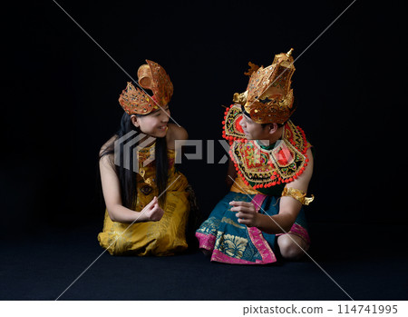 Indonesian Man and Woman in Traditional Dance Attire 114741995