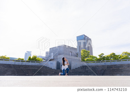 Woman dancing on stage Woman dancing on stage 114743210