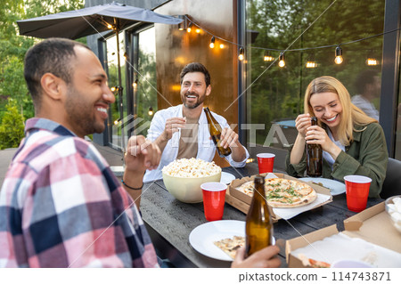 Happy friends having fun outdoor toasting beer glasses celebrating pleasant event 114743871