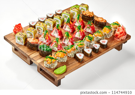 Colorful assorted set of Japanese sushi rolls on wooden tray 114744910