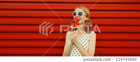 happy smiling young woman with fresh juicy fruits, lollipop or ice cream shaped slice of watermelon 114745660