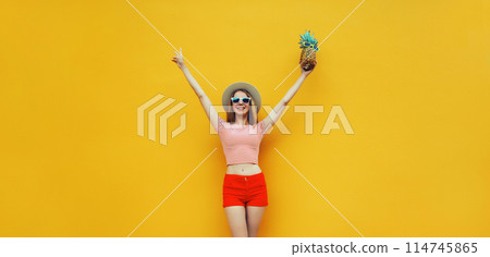Summer cheerful young woman having fun holding pineapple, emotional girl raising her hands up Summer cheerful young woman having fun holding pineapple, emotional girl raising her hands up 114745865