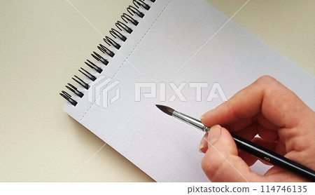 Notebook with spiral for watercolor. Mock up for artwork. 114746135