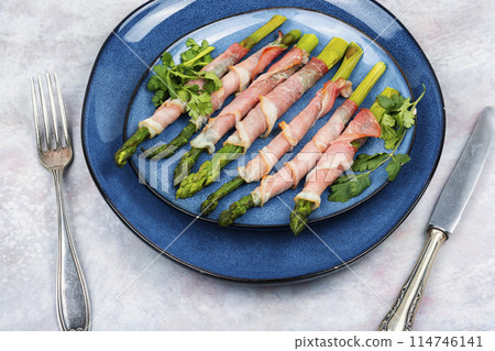 Asparagus baked with bacon and spices 114746141