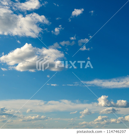 White fluffy clouds on blue sky. 114746207