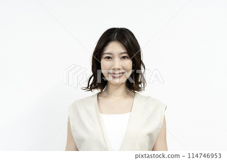 A woman in her thirties smiling at the camera A woman in her thirties smiling at the camera 114746953