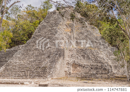 Coba, Mexico. Ancient mayan city in Mexico. Coba is an archaeological area and a famous landmark of Yucatan Peninsula. Cloudy sky over a pyramid in Mexico Coba, Mexico. Ancient mayan city in Mexico. Coba is an archaeological area and a famous landmark of Yucatan Peninsula. Cloudy sky over a pyramid in Mexico 114747881