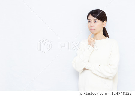 A woman who is seriously worried A woman who is seriously worried 114748122