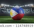 Soccer ball in flag colors on a bright blurred stadium background. Philippines. 3D image 114748919