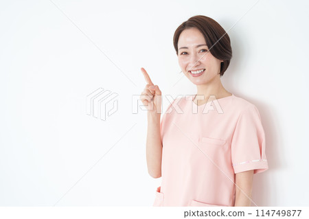Female nurse pointing (white background) Female nurse pointing (white background) 114749877