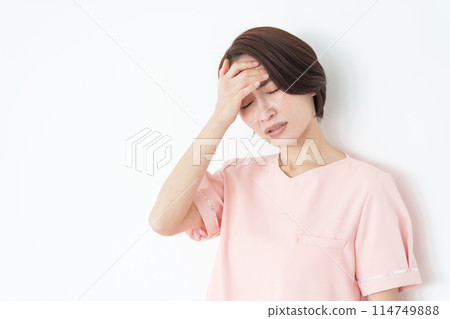 Female nurse who is unwell (white background) 114749888