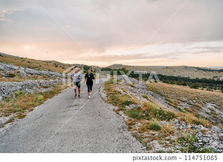 A Couple's Energizing Morning Run in the Mountains 114751085