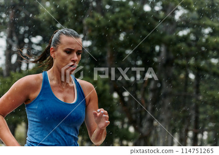 Unstoppable: A Determined Athlete Trains Through the Rain in Pursuit of Marathon Glory Unstoppable: A Determined Athlete Trains Through the Rain in Pursuit of Marathon Glory 114751265