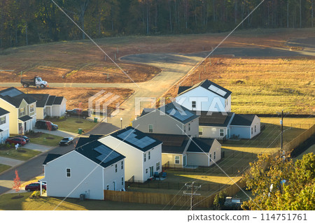 Aerial view of construction site with new tightly packed homes in South Carolina. Family houses as example of real estate development in american suburbs 114751761