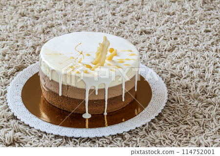 Delicious homemade chocolate marble birthday cake decorated with colorful stripes 114752001