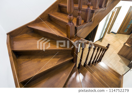 Close-up detail of brown wooden stairs 114752279