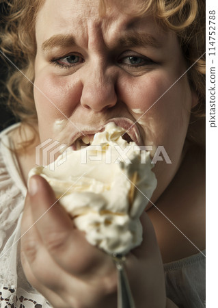 Woman with whipped cream on her face 114752788