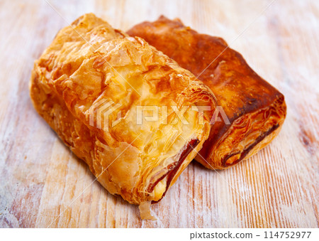 Neapolitan stuffed with ham and cheese closeup.  114752977