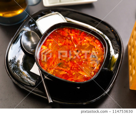 Russian cuisine - solyanka soup with various ingredients closeup Russian cuisine - solyanka soup with various ingredients closeup 114753630