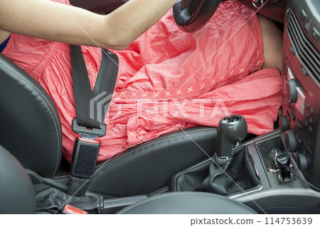 Young woman inside car buckled up with protective seat belt. Safety and precaution concept. 114753639