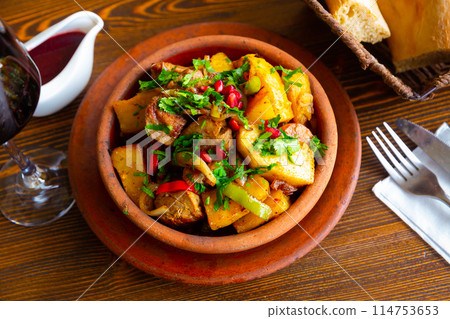 Georgian Ojakhuri with pomegranate in clay ketsi pan Georgian Ojakhuri with pomegranate in clay ketsi pan 114753653