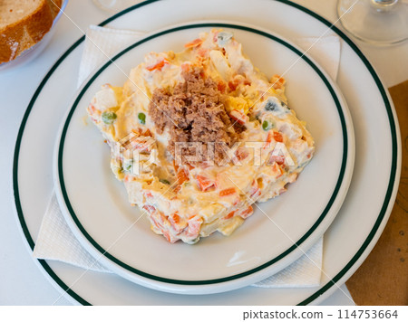Popular salad of Spanish cuisine called Ensalada rusa 114753664