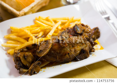 Pork knuckle with mushrooms 114753756