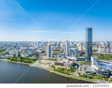 Yekaterinburg city with Buildings of Regional Government and Parliament, Dramatic Theatre, Iset Tower, Yeltsin Center, panoramic view at summer sunset. Yekaterinburg city with Buildings of Regional Government and Parliament, Dramatic Theatre, Iset Tower, Yeltsin Center, panoramic view at summer sunset. 114754455