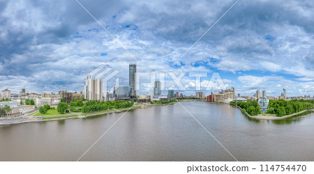 Yekaterinburg city with Buildings of Regional Government and Parliament, Dramatic Theatre, Iset Tower, Yeltsin Center, panoramic view at summer sunset. Yekaterinburg city with Buildings of Regional Government and Parliament, Dramatic Theatre, Iset Tower, Yeltsin Center, panoramic view at summer sunset. 114754470