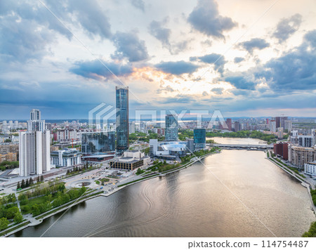 Yekaterinburg city with Buildings of Regional Government and Parliament, Dramatic Theatre, Iset Tower, Yeltsin Center, panoramic view at summer sunset. Yekaterinburg city with Buildings of Regional Government and Parliament, Dramatic Theatre, Iset Tower, Yeltsin Center, panoramic view at summer sunset. 114754487