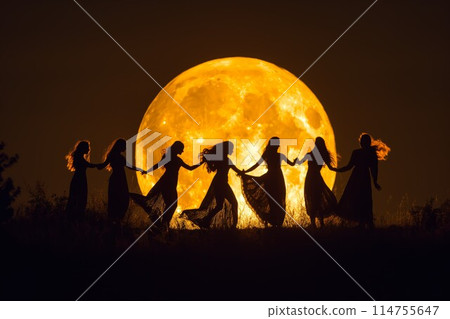 Women dancing under golden full moon 114755647