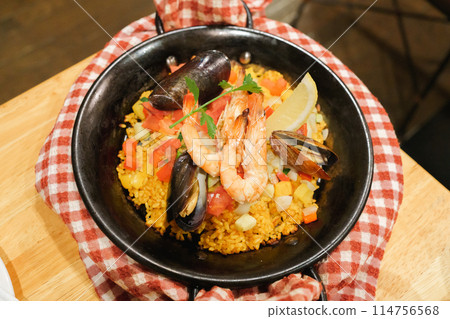 Eating paella Eating paella 114756568