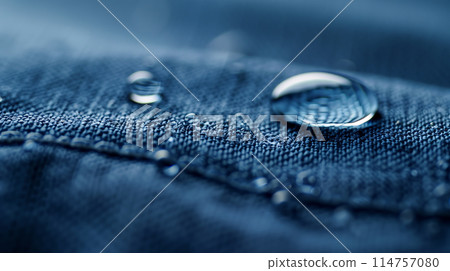 A close-up shot of a self-cleaning fabric with a water droplet rolling off effortlessly 114757080