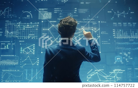 Man Standing in Front of Wall Covered in Diagrams 114757722