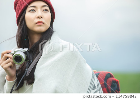 A woman taking a picture 114759842