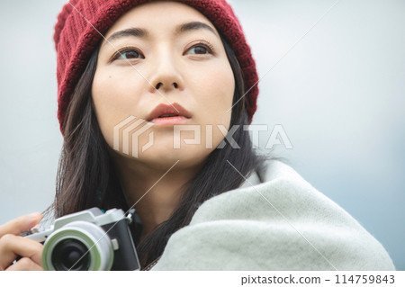A woman taking a picture 114759843