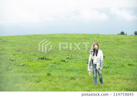 A woman taking a picture A woman taking a picture 114759845