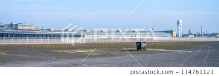 View of the historic Berlin Tempelhof Airport main building with open space and clear skies. Berlin, Germany View of the historic Berlin Tempelhof Airport main building with open space and clear skies. Berlin, Germany 114761121