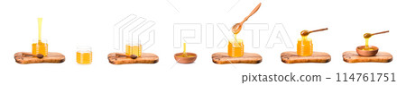 Wooden bowl full of honey and wooden dipper on wooden plank isolated on white 114761751