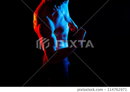 Portrait of man, bodybuilder and bicep flex in studio, background and exercise for muscular power. 114762971