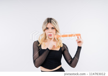 Teenager school female holding measure for geometry lesson. Measuring equipment. Kid study math. Teenager school female holding measure for geometry lesson. Measuring equipment. Kid study math. 114763012