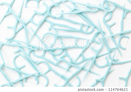 Dental floss on white background 114764621