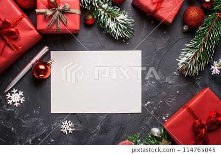 Blank Paper Surrounded by Christmas Decorations Blank Paper Surrounded by Christmas Decorations 114765045