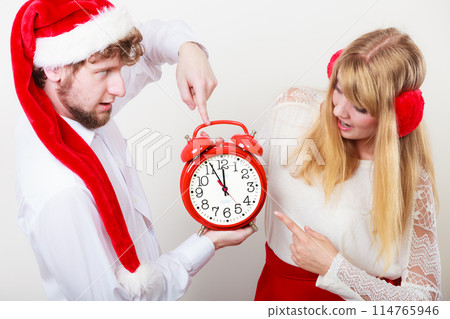 Happy couple woman and man with alarm clock. Happy couple woman and man with alarm clock. 114765946