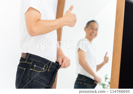 Middle-aged man diet thumbs up 114766695
