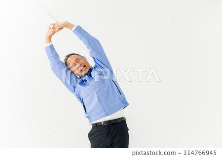 Man in work clothes stretching 114766945